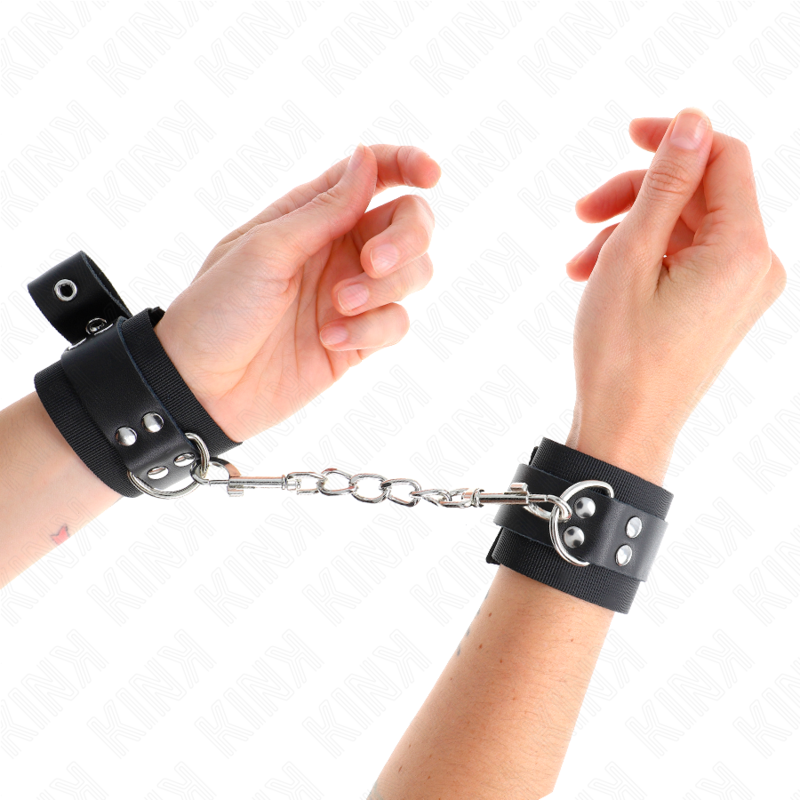 KINK - RESISTENZA DA POLSO IN NYLON NERO CON CINTURA IN PELLE NERA REGOLABILE 19-29 CM X 5,1 CM - KINK COLLAR & GAG | Lingerie Harness Boutique