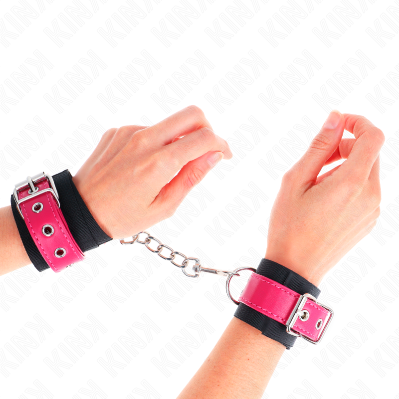 KINK - RESISTENZA DA POLSO IN NYLON NERO CON CINTURA IN SIMILPELLE ROSA LAMPONE REGOLABILE 19-29 CM X 5,1 CM - KINK COLLAR & GAG | Lingerie Harness Boutique