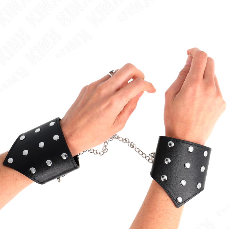 KINK - BRACCIALI STILE PUNTO NERO CON CATENA REGOLABILE 17-23 CM X 8,5 CM - KINK COLLAR & GAG | Lingerie Harness Boutique
