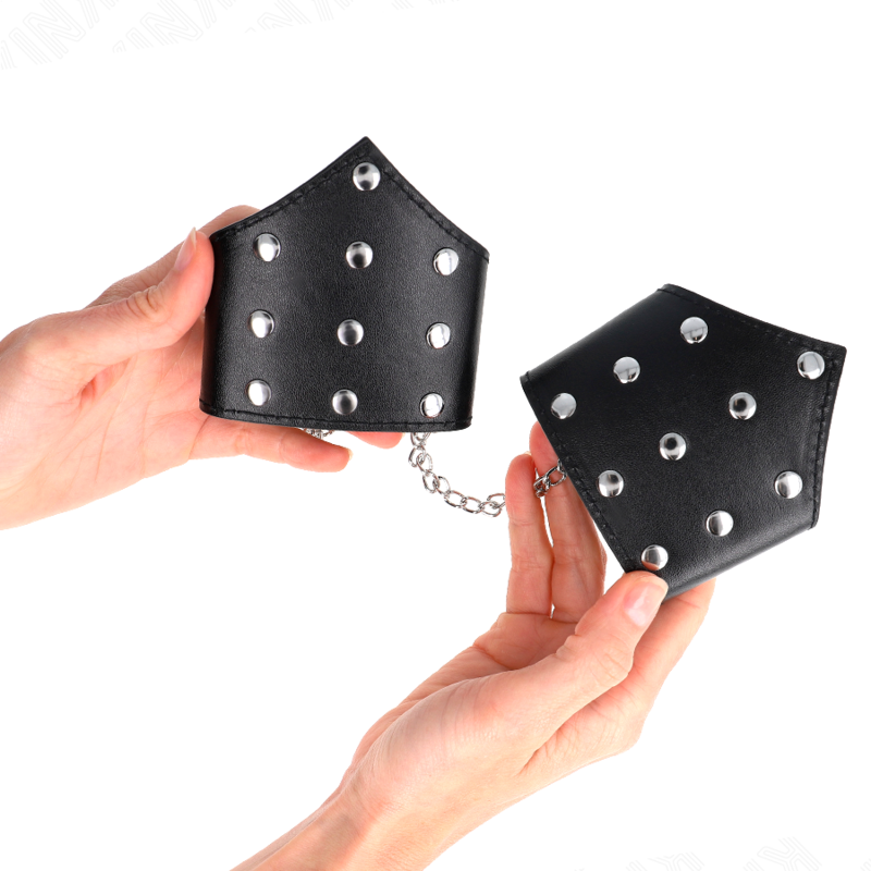 KINK - BRACCIALI STILE PUNTO NERO CON CATENA REGOLABILE 17-23 CM X 8,5 CM - KINK COLLAR & GAG | Lingerie Harness Boutique